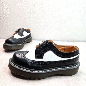 Dr. Martens Black and White Brogue Flats